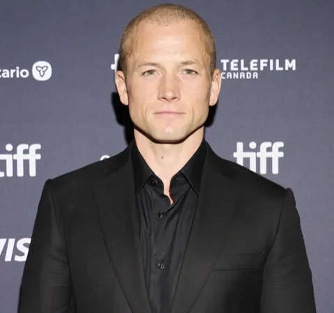 Photo: Gabriel Hutchinson, CC BY-SA 4.0, via Wikimedia Commons Taron Egerton, typed as True Autumn